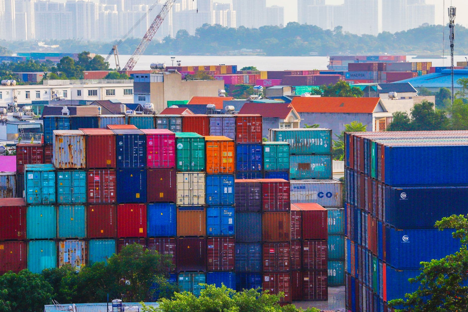 Shipping containers stacked in a port container yard